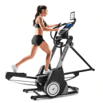 A fit woman in athletic attire working out on the FS9i Trainer
